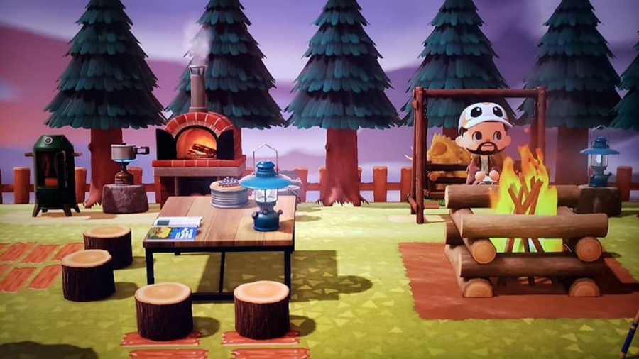 キャンプ場の設定で、どうぶつの森のキャラクターがピクニック テーブルに座っていた
