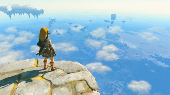 ベスト オープンワールド ゲーム: リンクは空高くのプラットホームに立って、雲の間からハイラルを見下ろします。