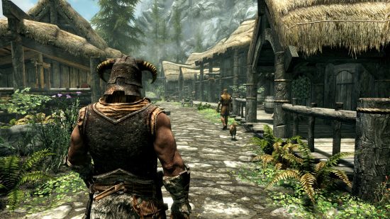 ベストオープンワールドゲーム: 中世の鎧を着て村を歩くスカイリムのキャラクター