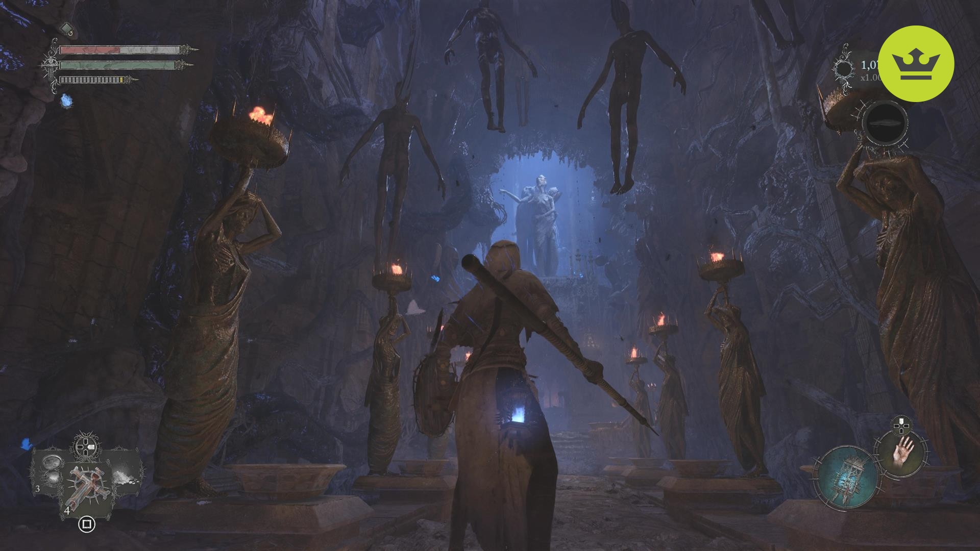 Lords of the Fallen レビュー: 吊り下げられた死体と火の松明を持った彫像に囲まれた、暗いアンブラル領域にいるプレイヤーのゲーム内スクリーンショット