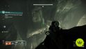 Destiny 2 ザ コイル: プレイヤーは、ザ コイルで隠された宝箱が見つかる岩壁の小さな隙間を覗いています。